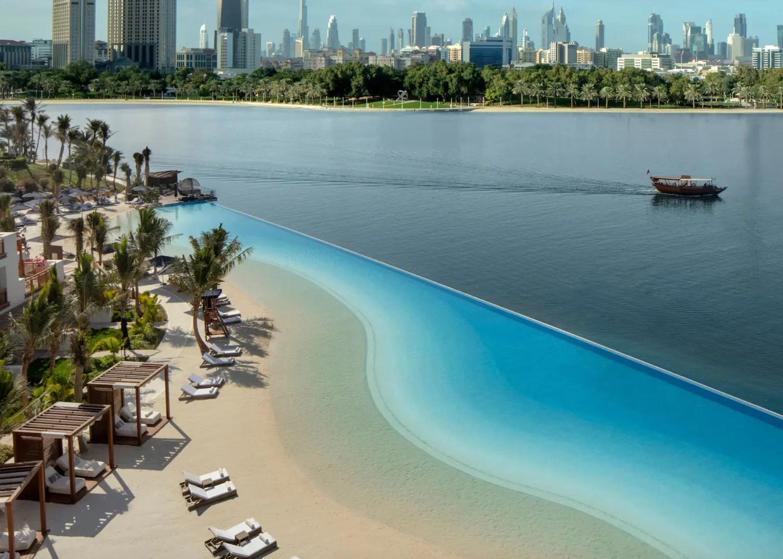 Beachfront pool by water at Park Hyatt Dubai