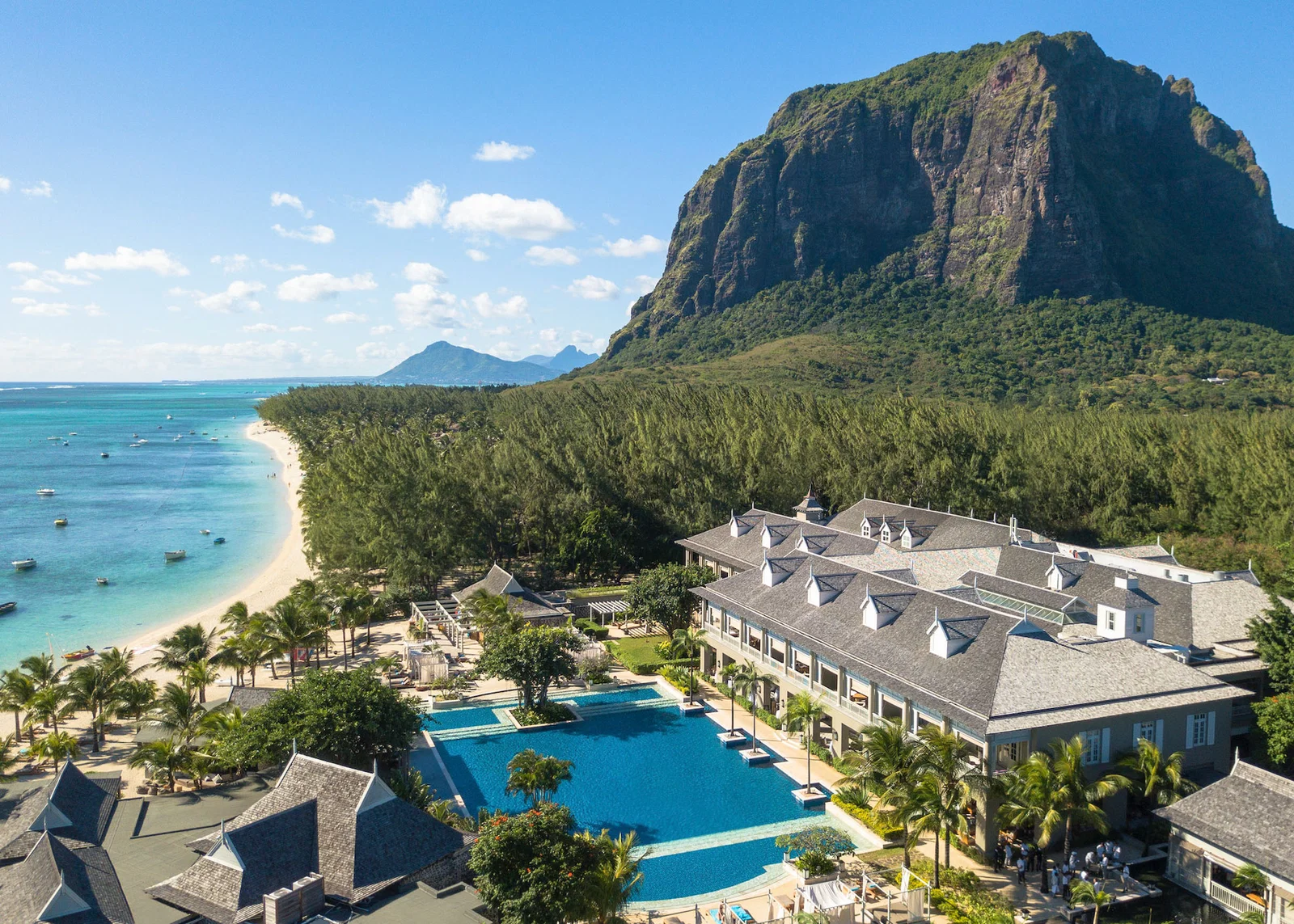 Aerial shot of resort pool and beachfront by Le Morne Mountain