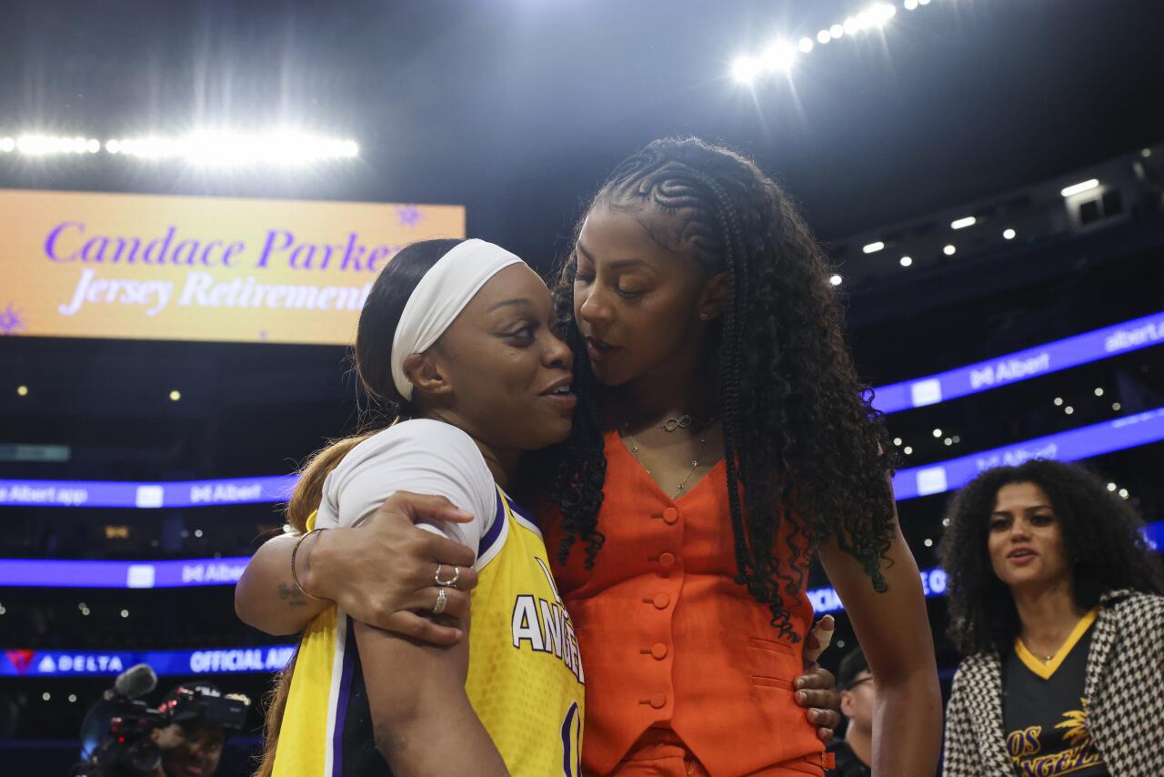 Candace Parker, right, interacts with Sparks guard Odyssey Sims on Sunday.