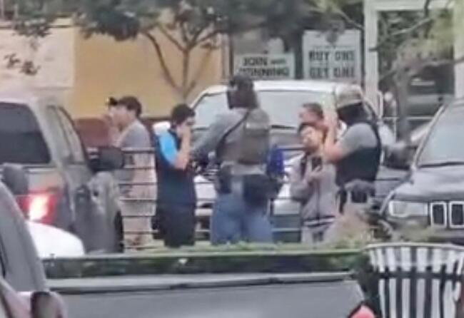 A screenshot from a video by a witness of an L.A. Home Depot raid.