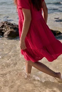 Image of model wearing the pebble comb organic cotton tiered dress