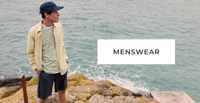 Image of male model by the sea. Menswear.