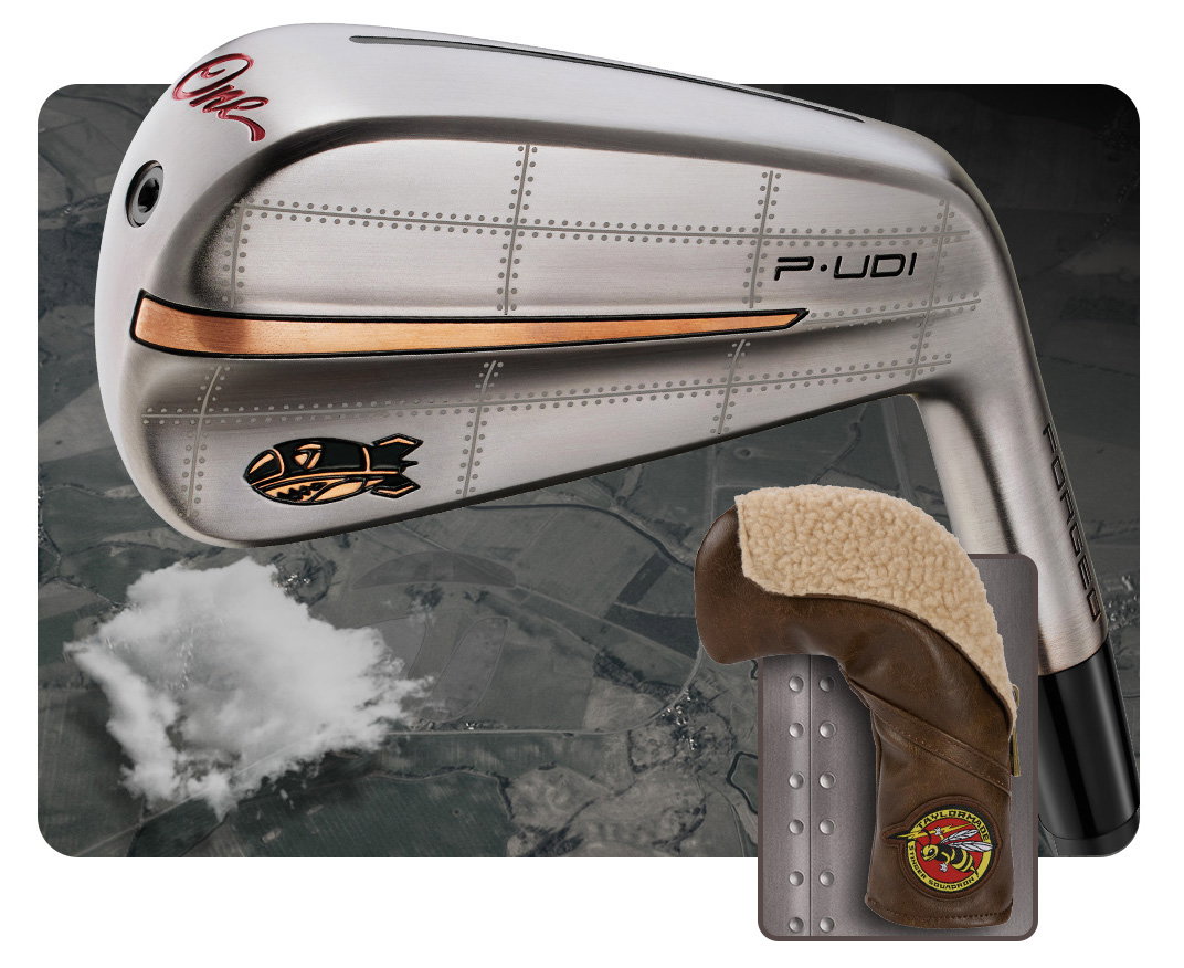 Close up of the P-UDI Bomber Iron and headcover on a background that includes a terrain grid and clouds
