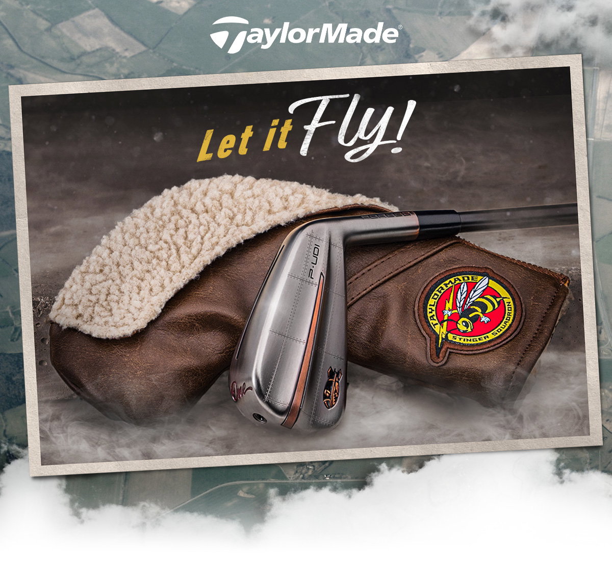 P-UDI Bomber Iron and headcover with 'Let it Fly' in text above on a background that includes a terrain grid and clouds