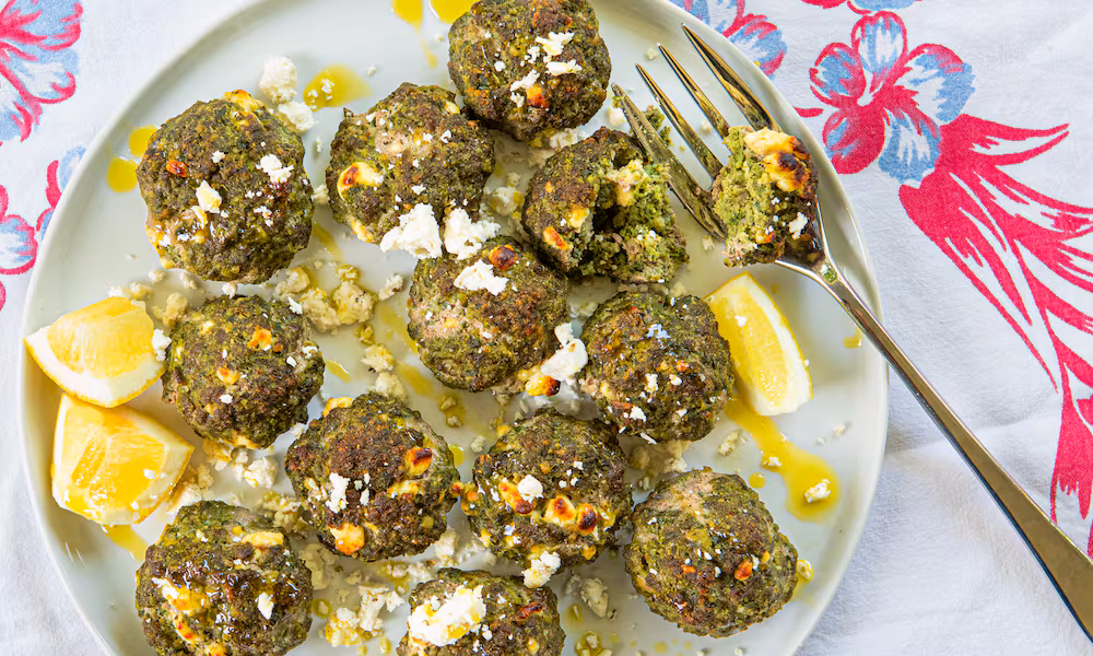 Spanakopita meatballs use the high amount of water in spinach to advantage. (Aaliyah Man for The Atlanta Journal-Constitution/Food styling by Kate Williams)
