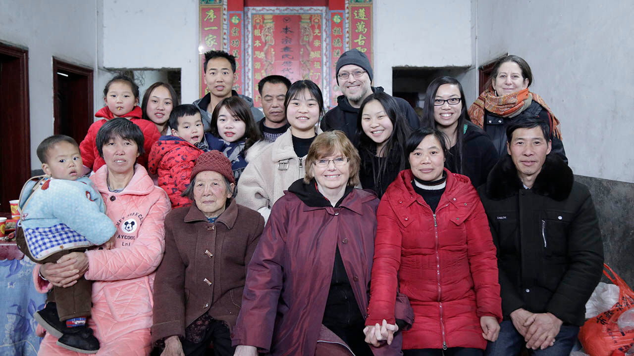 Posing in front of the family shrine in 2018