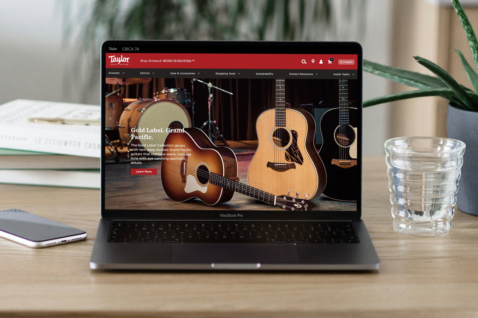 The Taylor Guitars website on a laptop