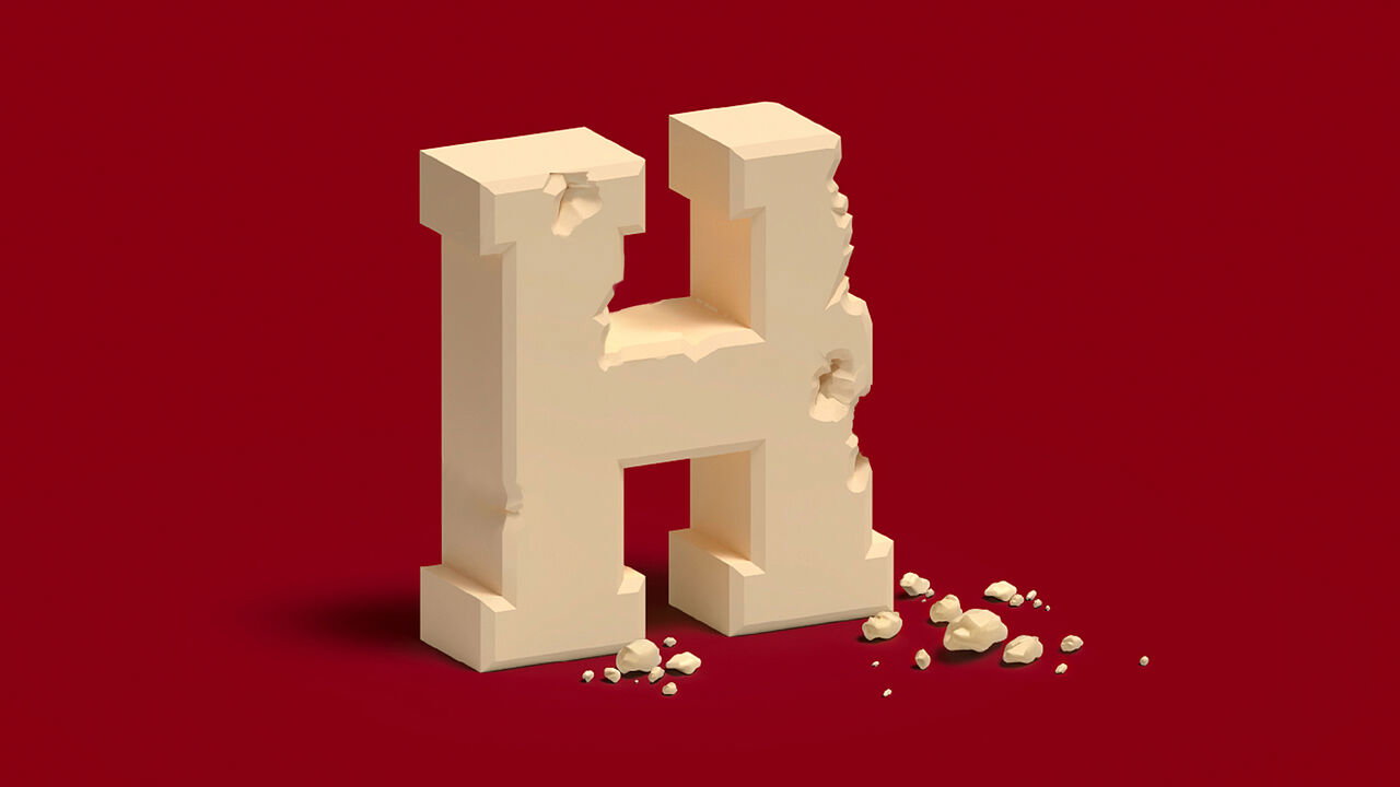 The H of Harvard made of crumbling stone.