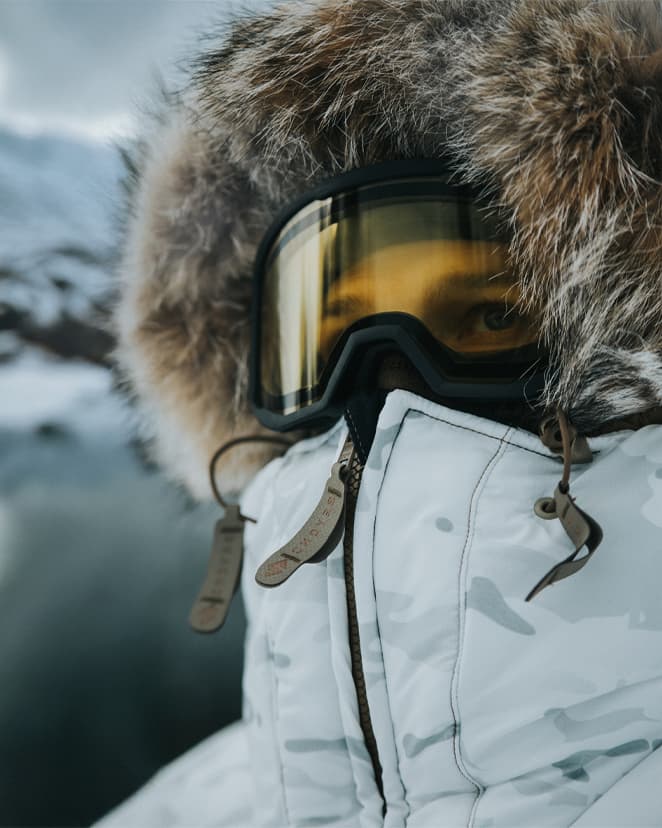 Man wearing the Chosin ECW Parka by Beyond Clothing while wearing googles.