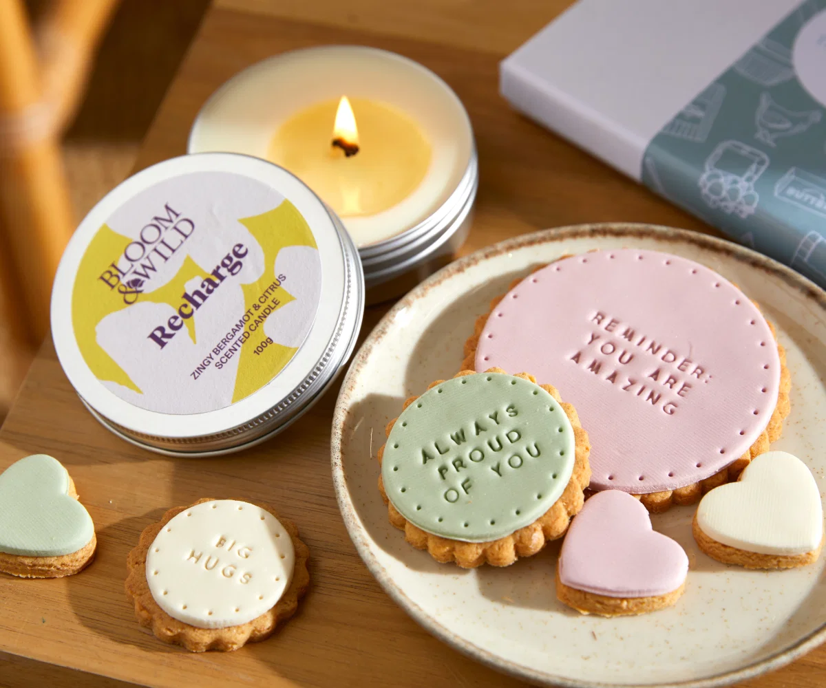 A close up image of iced biscuits with uplifting messages in the icing including 