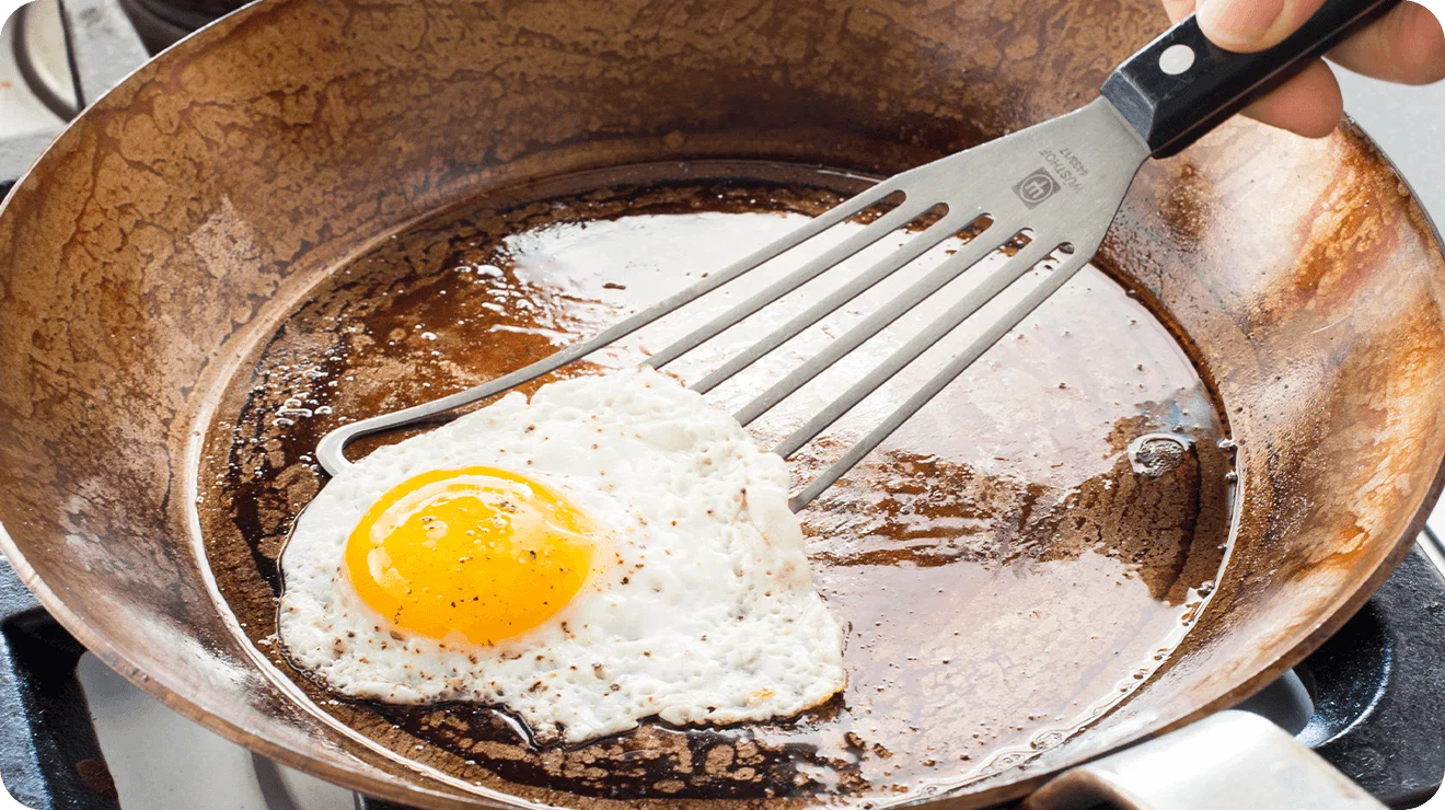 Flipping and egg with our winner, the Wüsthof Gourmet Slotted Fish Spatula