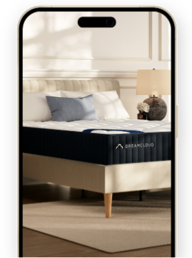 a phone shows a bed with a dreamcloud mattress