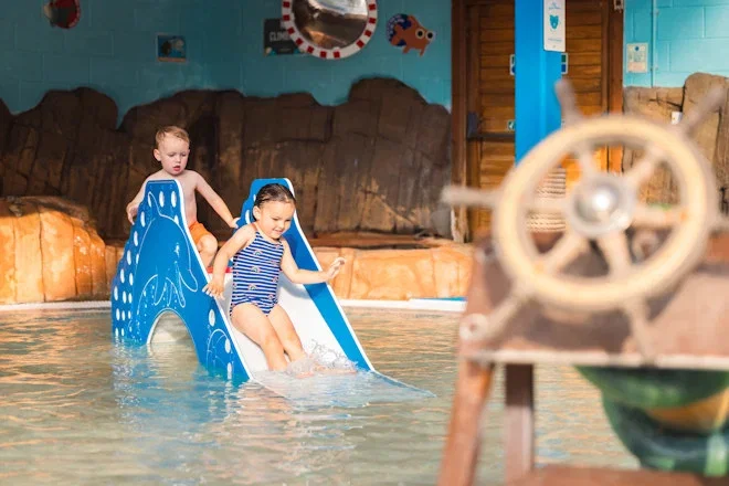 brother and sister going down slide at blue lagoon