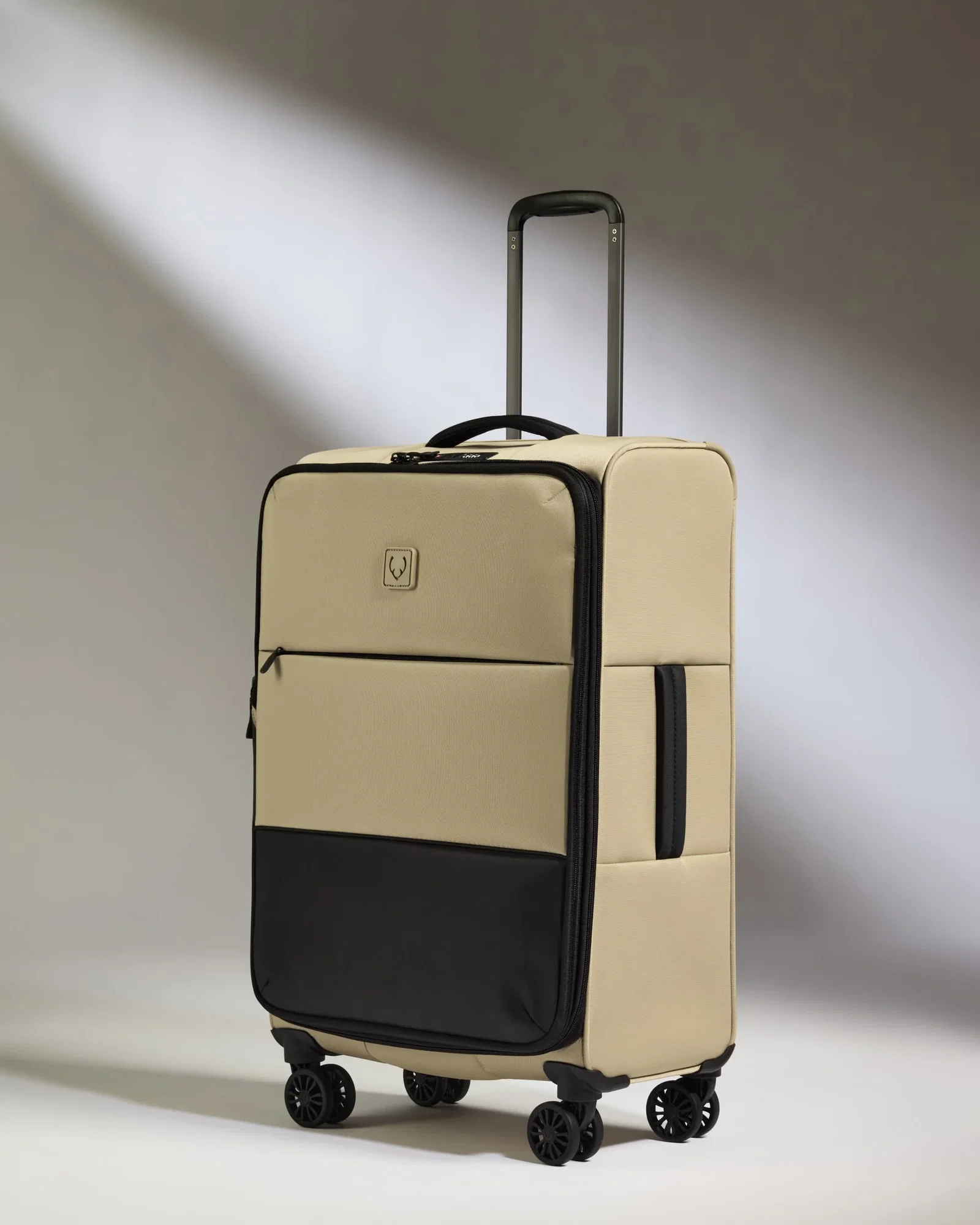 Image of Lightest Medium Luggage in Sand - Soft Stripe 2.0