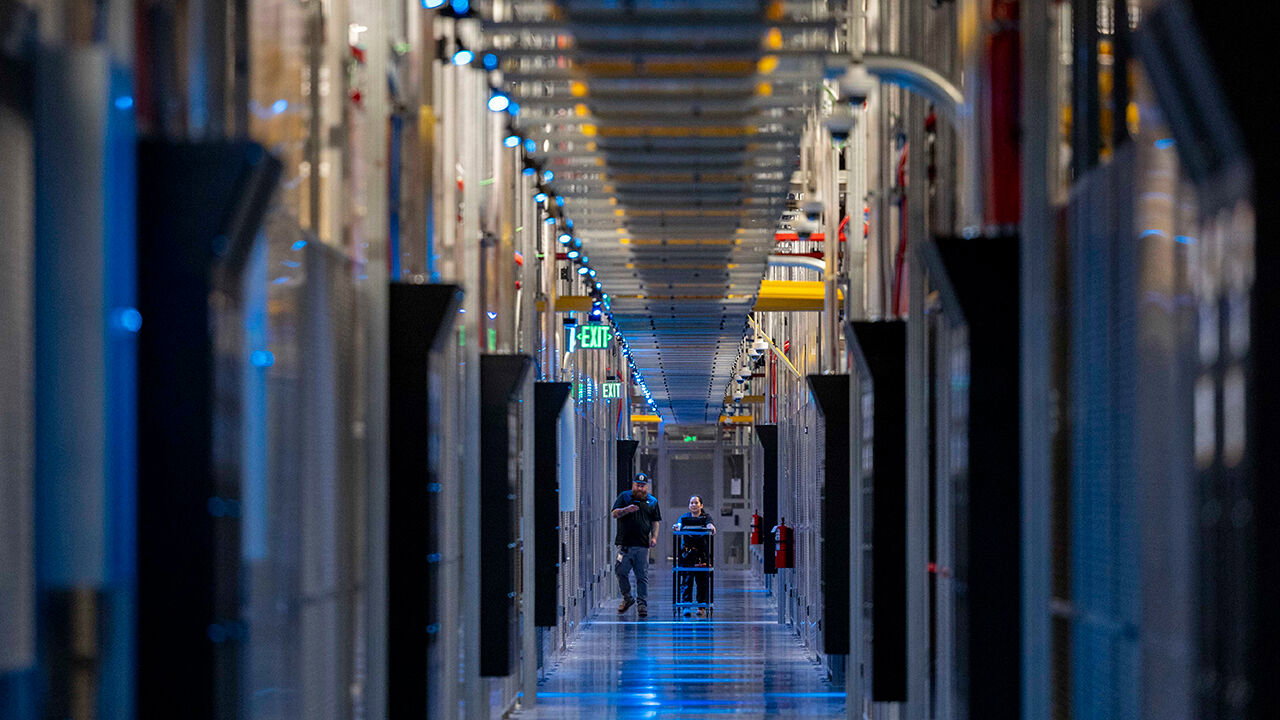 People walk through the hallways at Equinix Data Center in Ashburn, Virginia