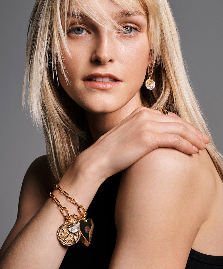 Model styled in link chain bracelet with Pandora Talismans