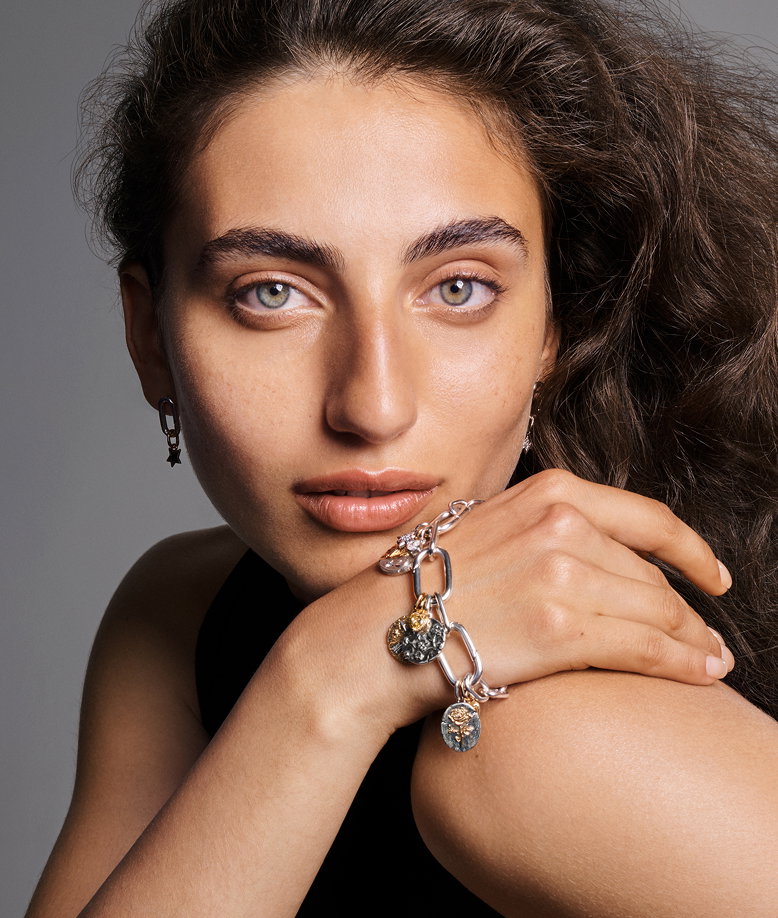 Model styled in mixed metal Pandora Talisman bracelet