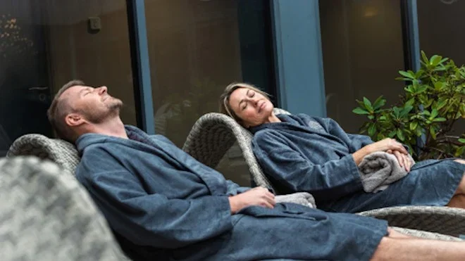 couple receiving massage at well spa