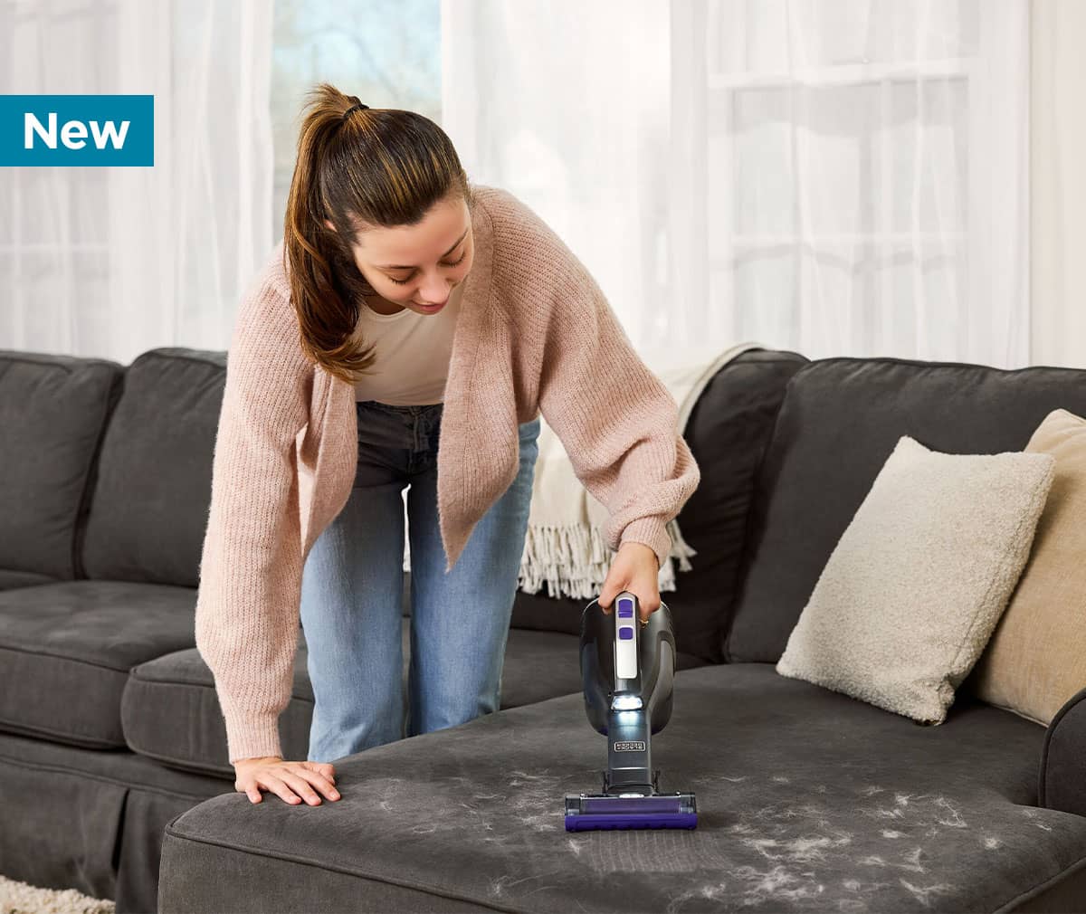 NEW dustbuster® reveal™ Cordless Handheld Pet Vacuum in use around the house