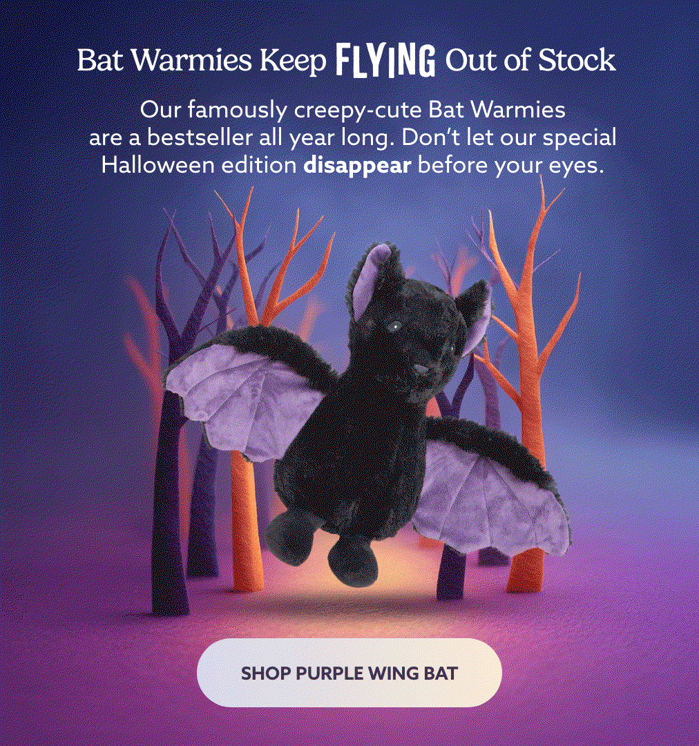 Purple Wing Bat Warmies flying in a spooky forest. Shop Purple Wing Bat.