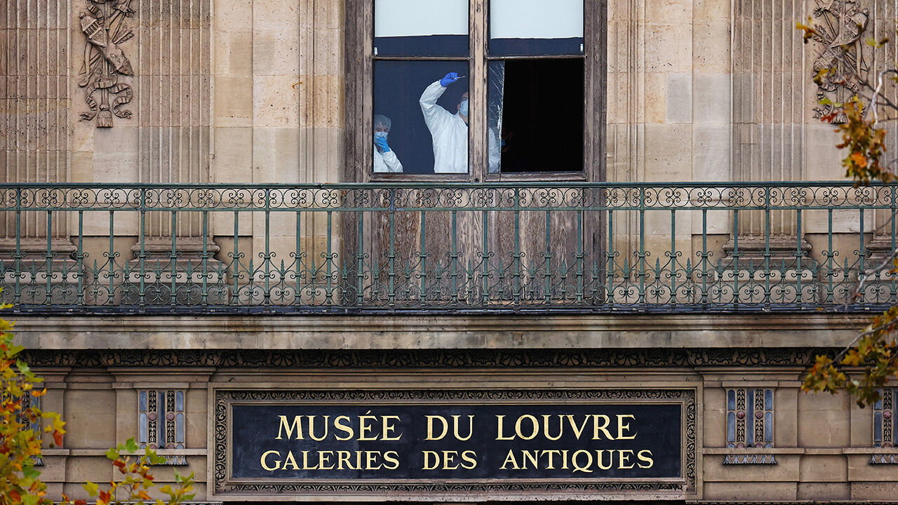 Members of a forensic team inspect a window believed to have been used in what the French Interior Ministry said was a robbery at the Louvre museum during which jewellery was stolen, in Paris, France, October 19, 2025.