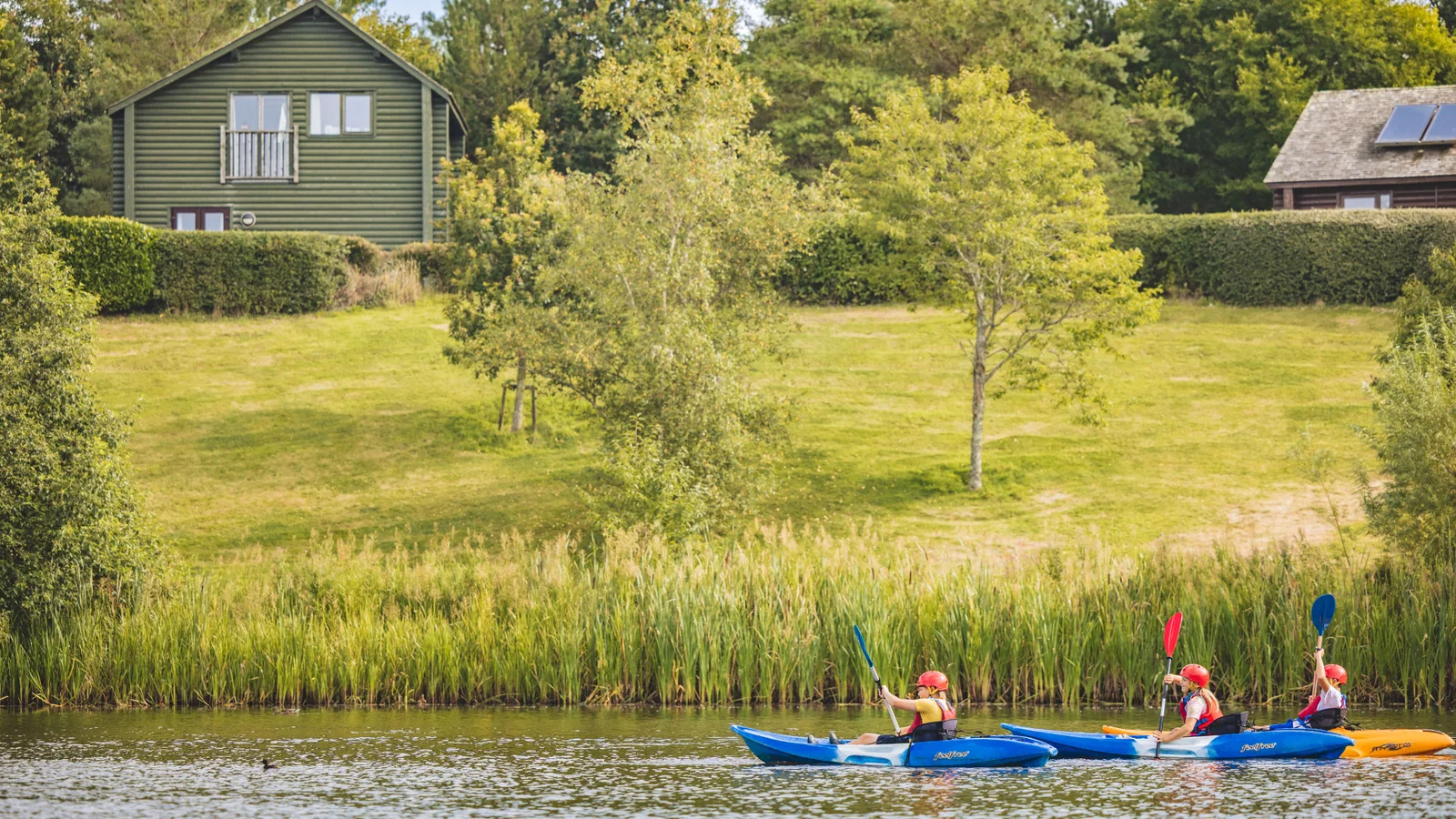 family kayaking on bluestone lake