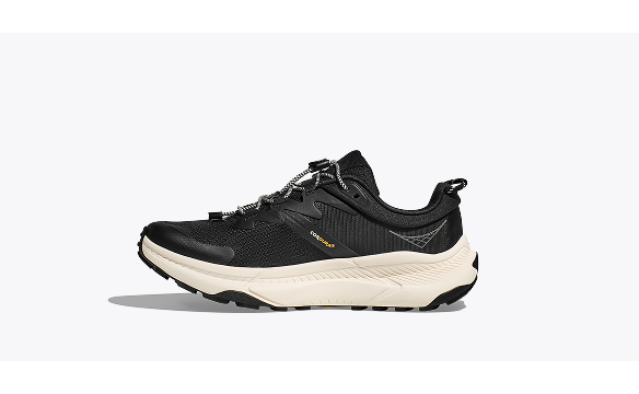 A side view image of the HOKA Transport walking shoe in Black / Alabaster.