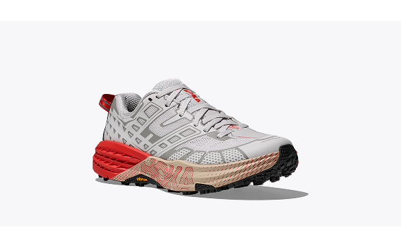 A side view image of the HOKA Speedgoat 2 lifestyle shoe in White / Tomato.