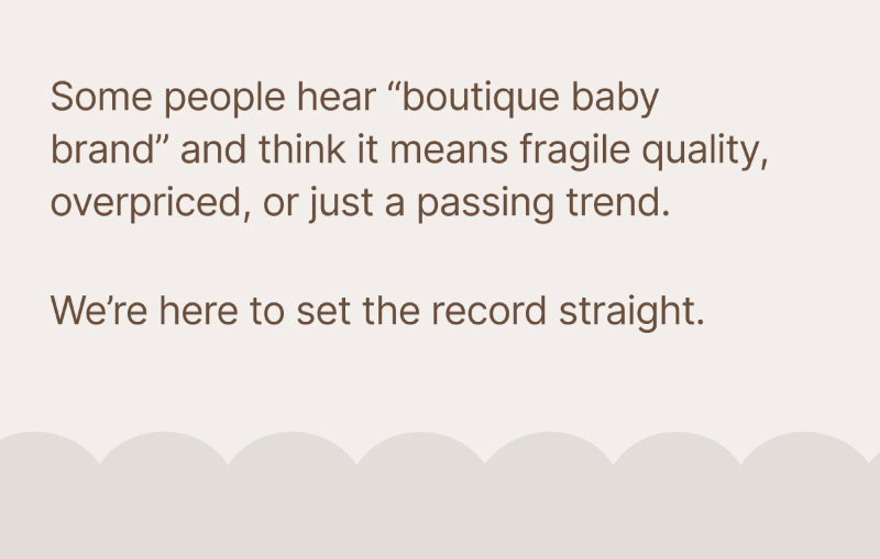 Neutral beige background with serif paragraph text explaining perceptions of boutique baby brands and reassuring readers that Wyld Bub creates durable, quality keepsakes.
