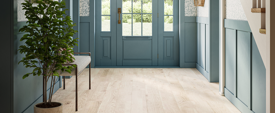 Foyer with light blonde wood-look LVP flooring.