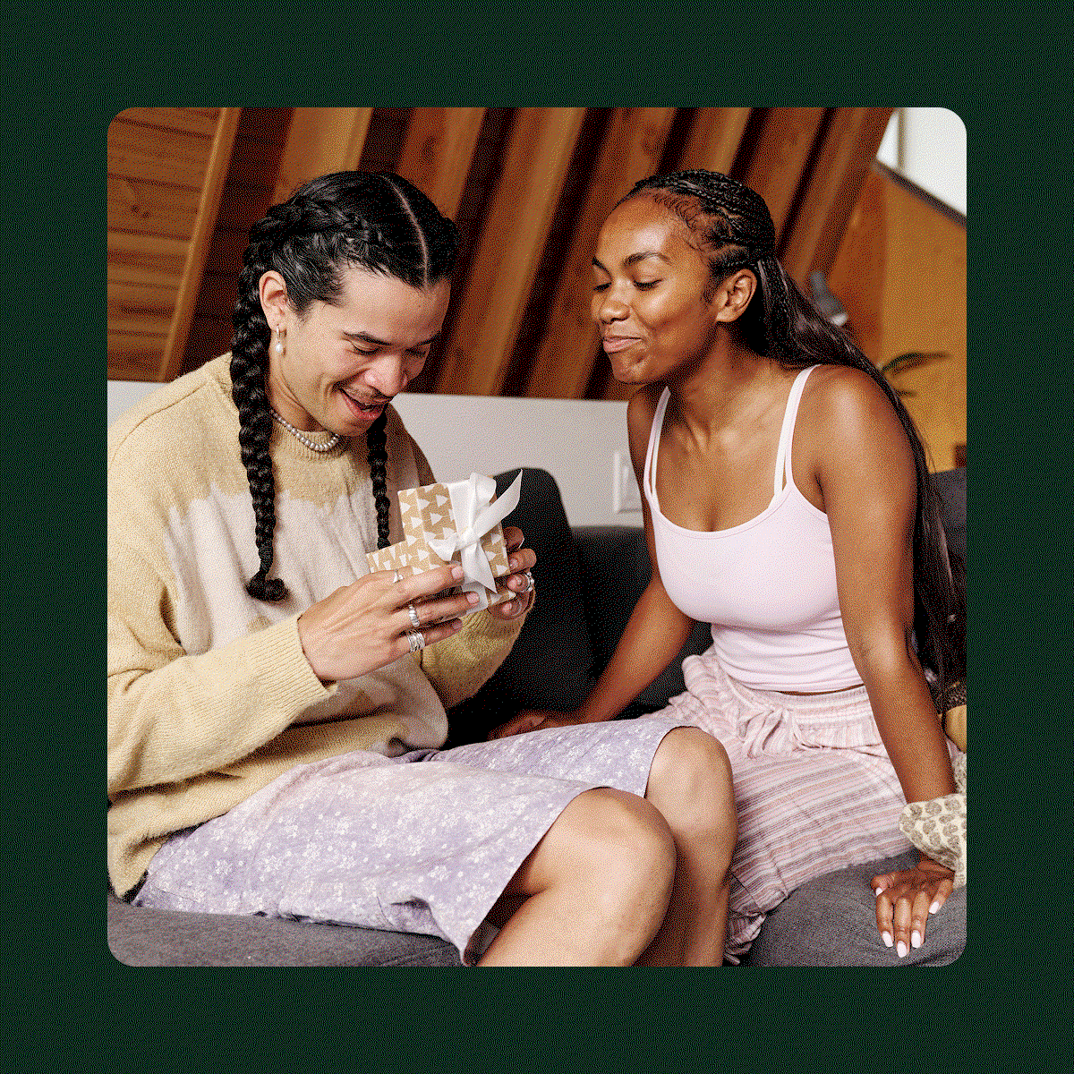 Gif comprising of three images: 1. Person opening small gift box, next to person smiling 2. Person reading sitting on a chair 3. Image of a man seen from behind climbing a mountain peak and wearing Mafate X Hike shoe.