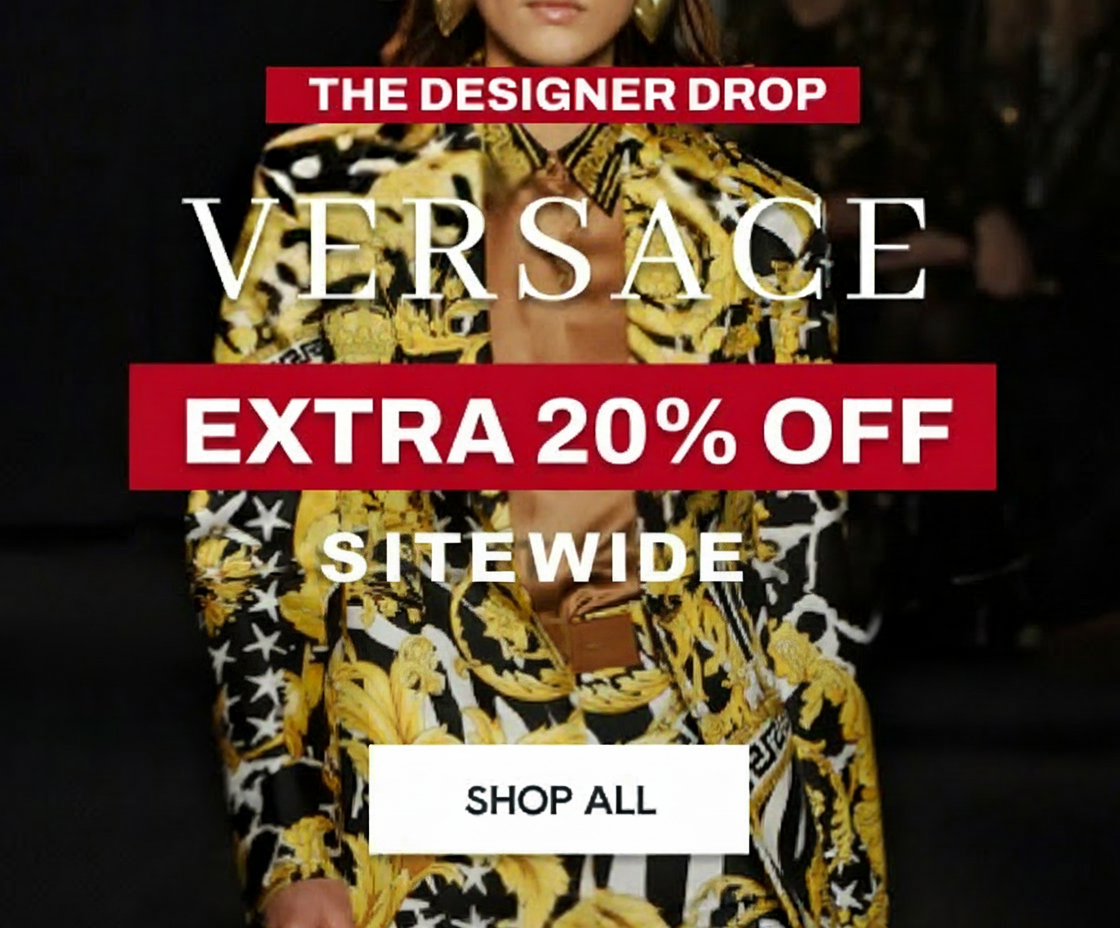 an image of a woman wearing a yellow and black dress with a large flower print on it