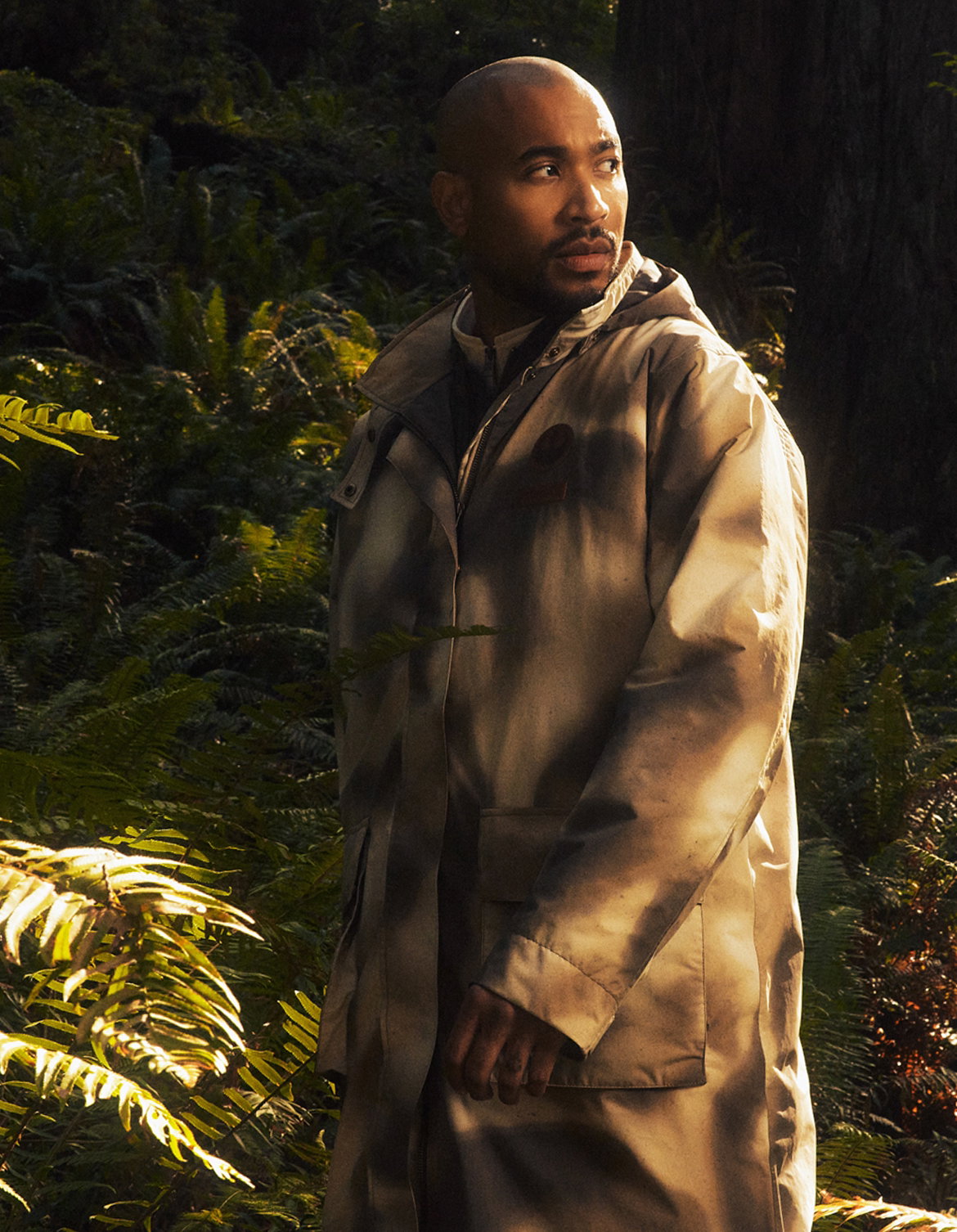 Man in a forest wearing General Han Solo trench.