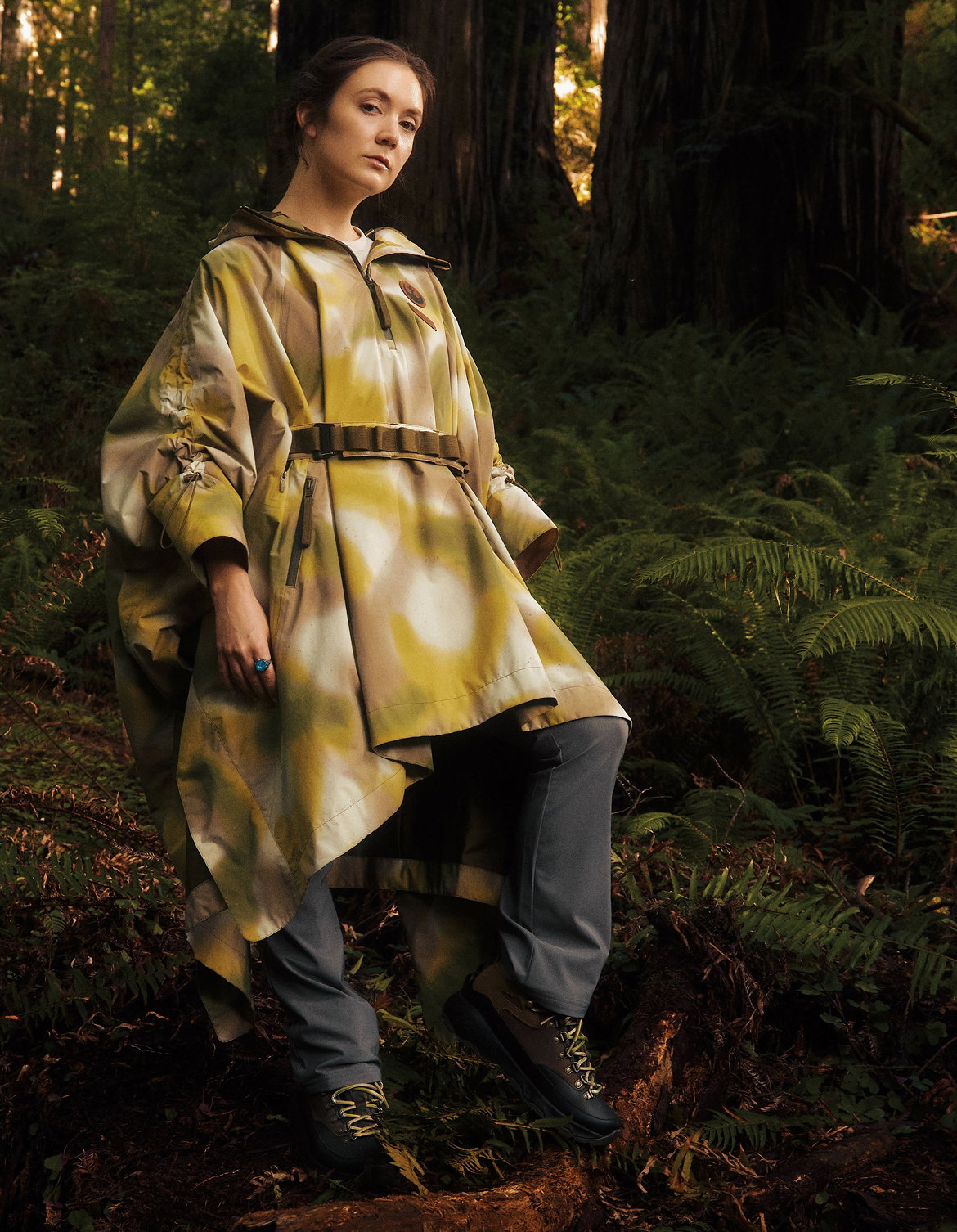 Woman in a forest wearing Endor Issue Poncho.