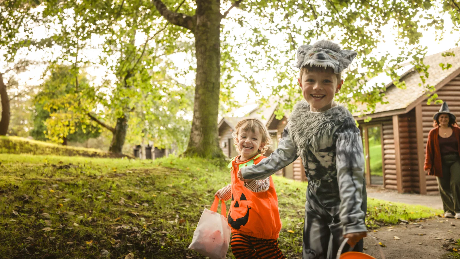 child with pumpkins at autumn