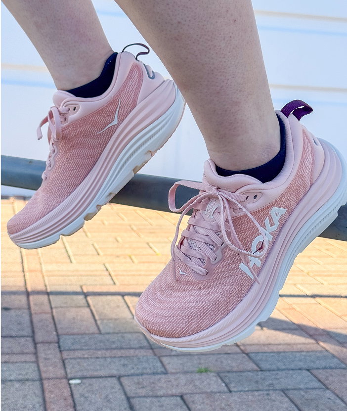 woman wearing blue Hoka Bondi 9
