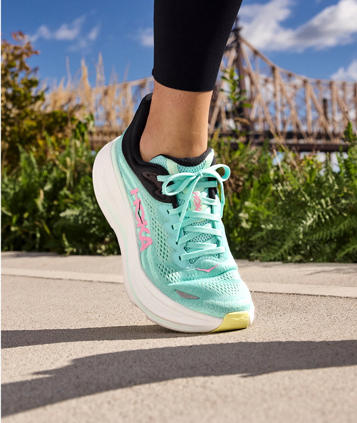 woman wearing blue Hoka Bondi 9