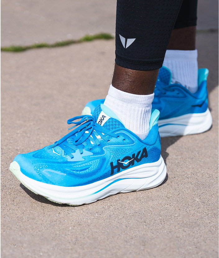 Man wearing blue Hoka Clifton 10