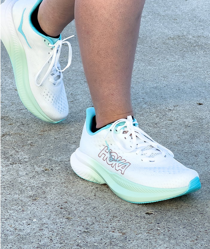 woman wearing blue Hoka mach 6