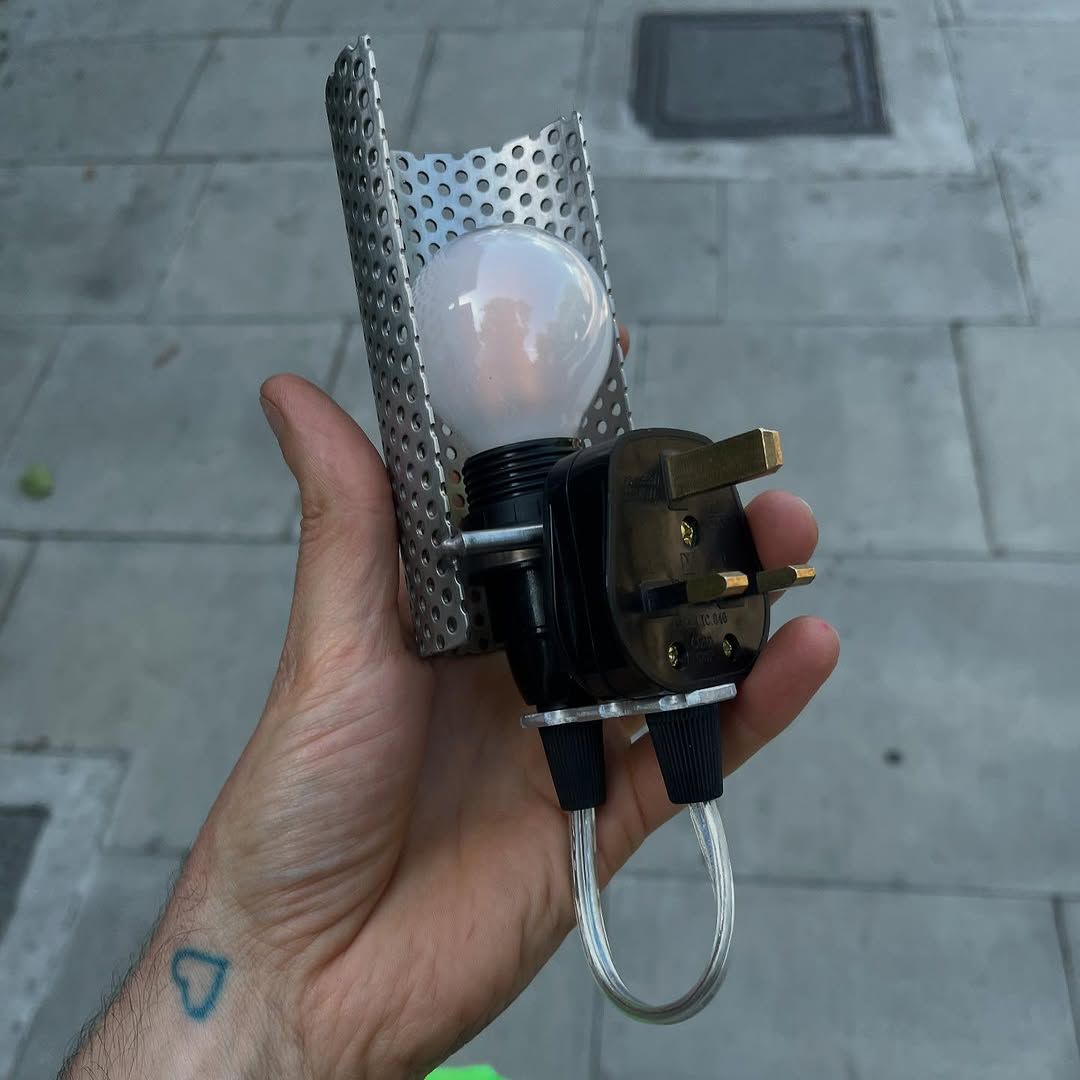 Simple light comprising plug, lightbulb and shade