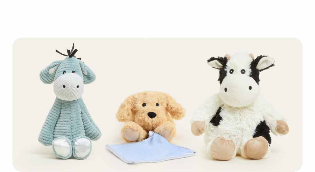 Gifts for Babies Collection Warmies on a beige background. Shop Now.