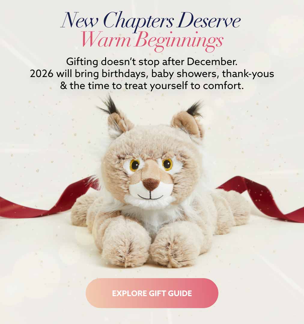 Bobcat Warmies with a gift ribbon in the background. Explore GIft Guide.
