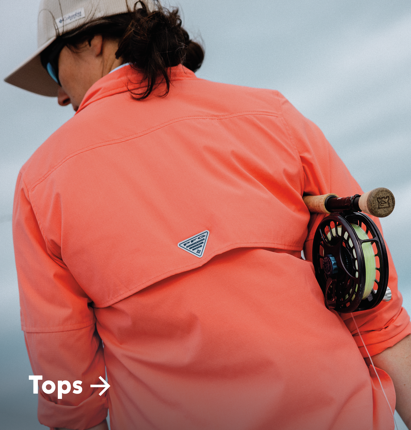 The back view of someone wearing a PFG top
