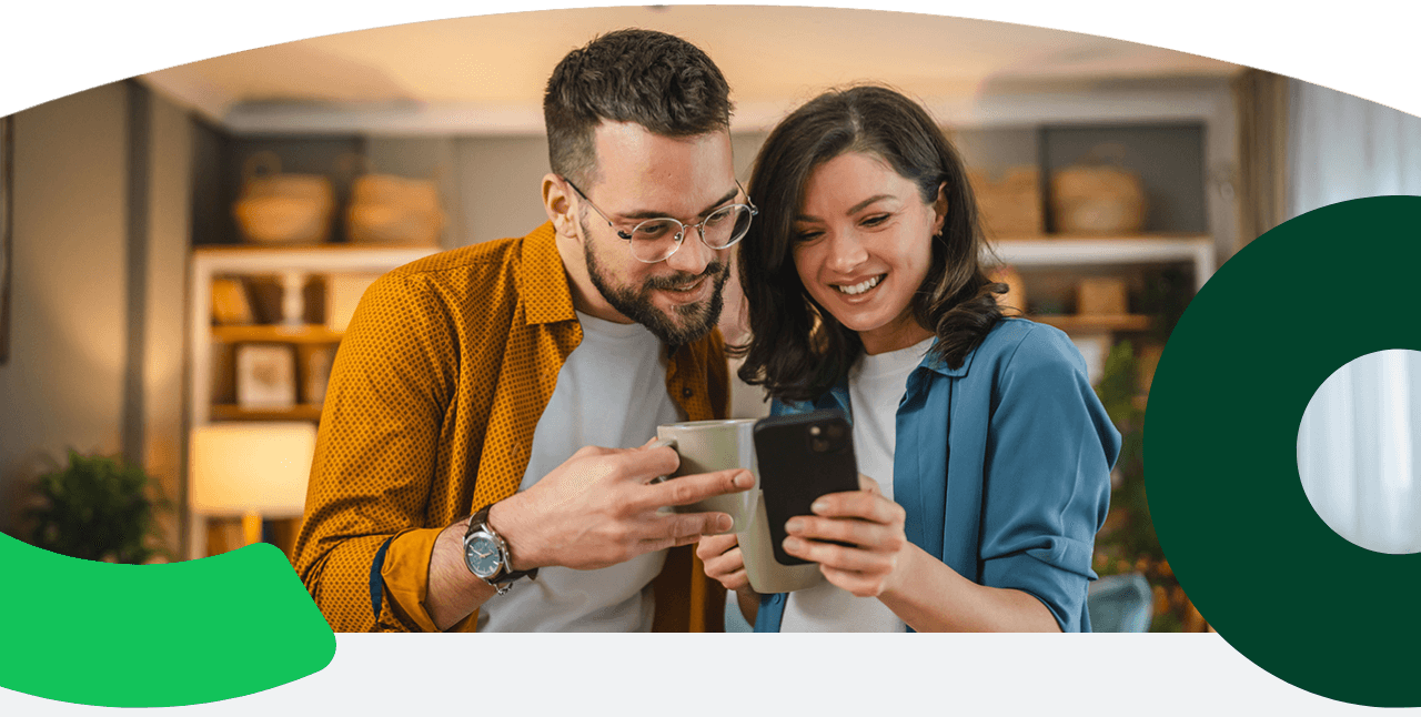 Two friends smiling at a phone