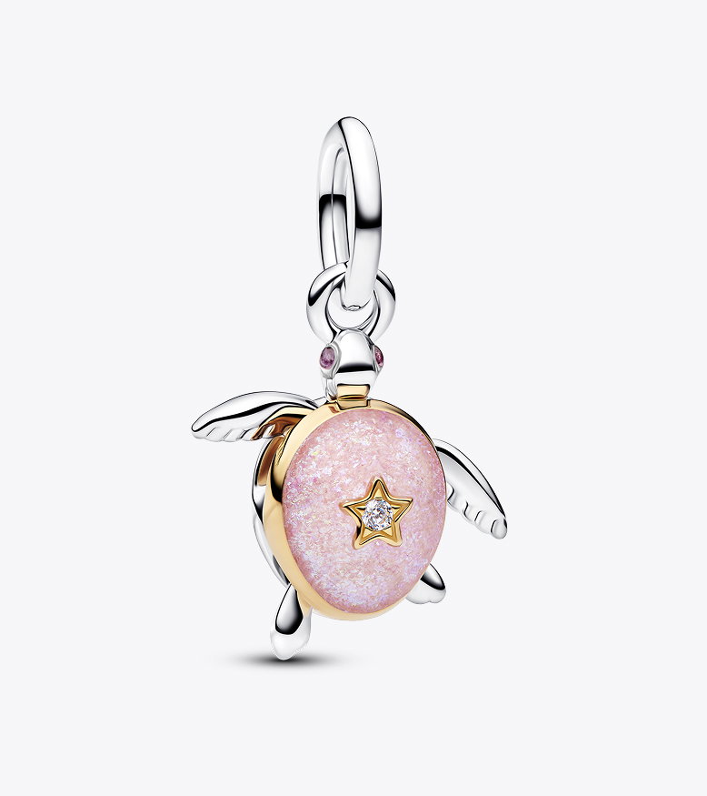 A turtle charm with a pink enamel shell and lab-grown diamond