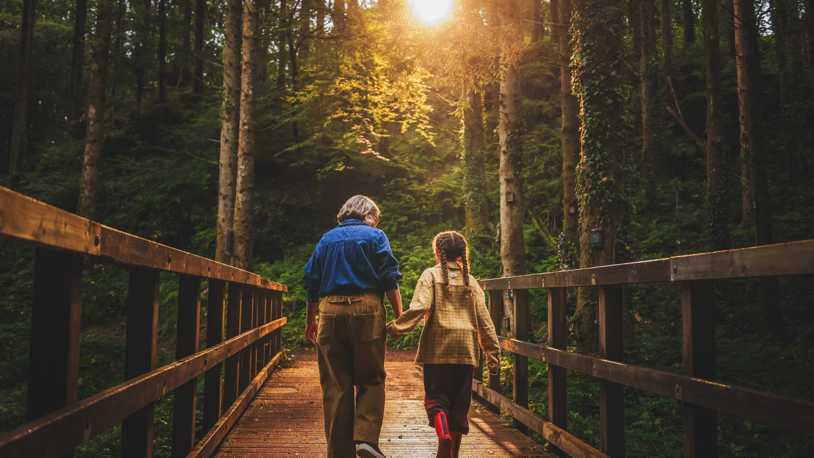 grandmother and granddaughter walking nature trail