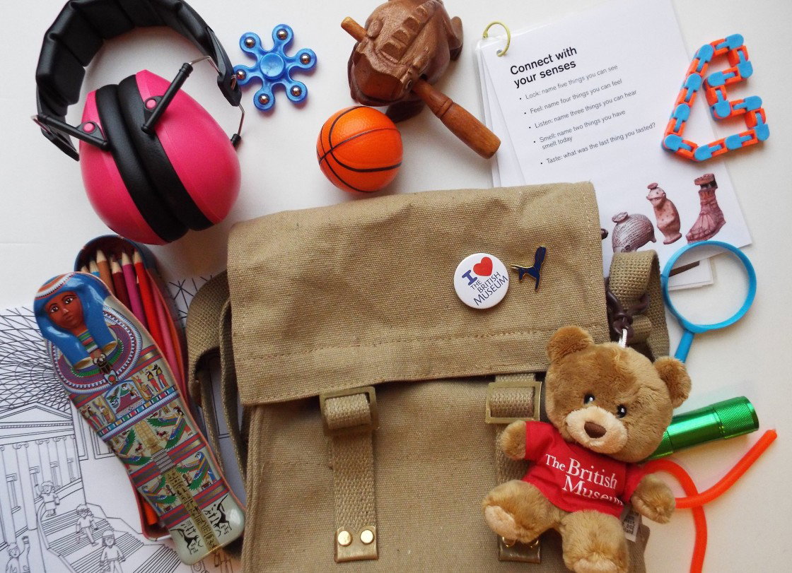 A selection of different sensory toys surrounding a brown bag.