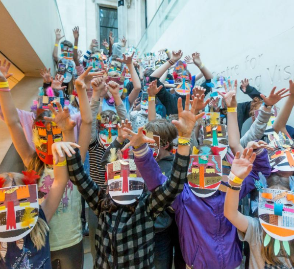 Sleepover participants wearing mosaic masks. 