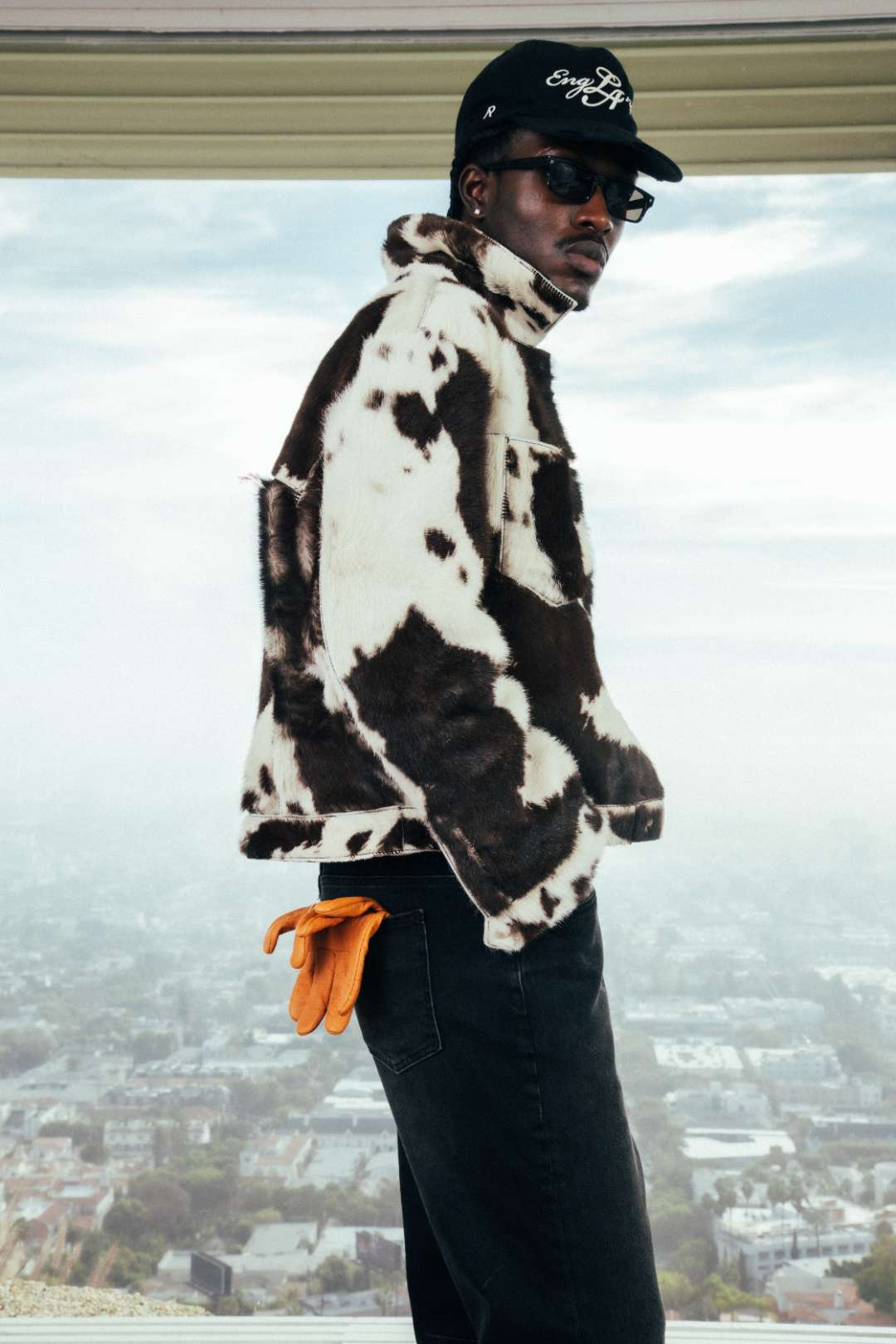 Model wearing the Cowhide Trucker Jacket and the Represent x 47 EngLAnd Cap