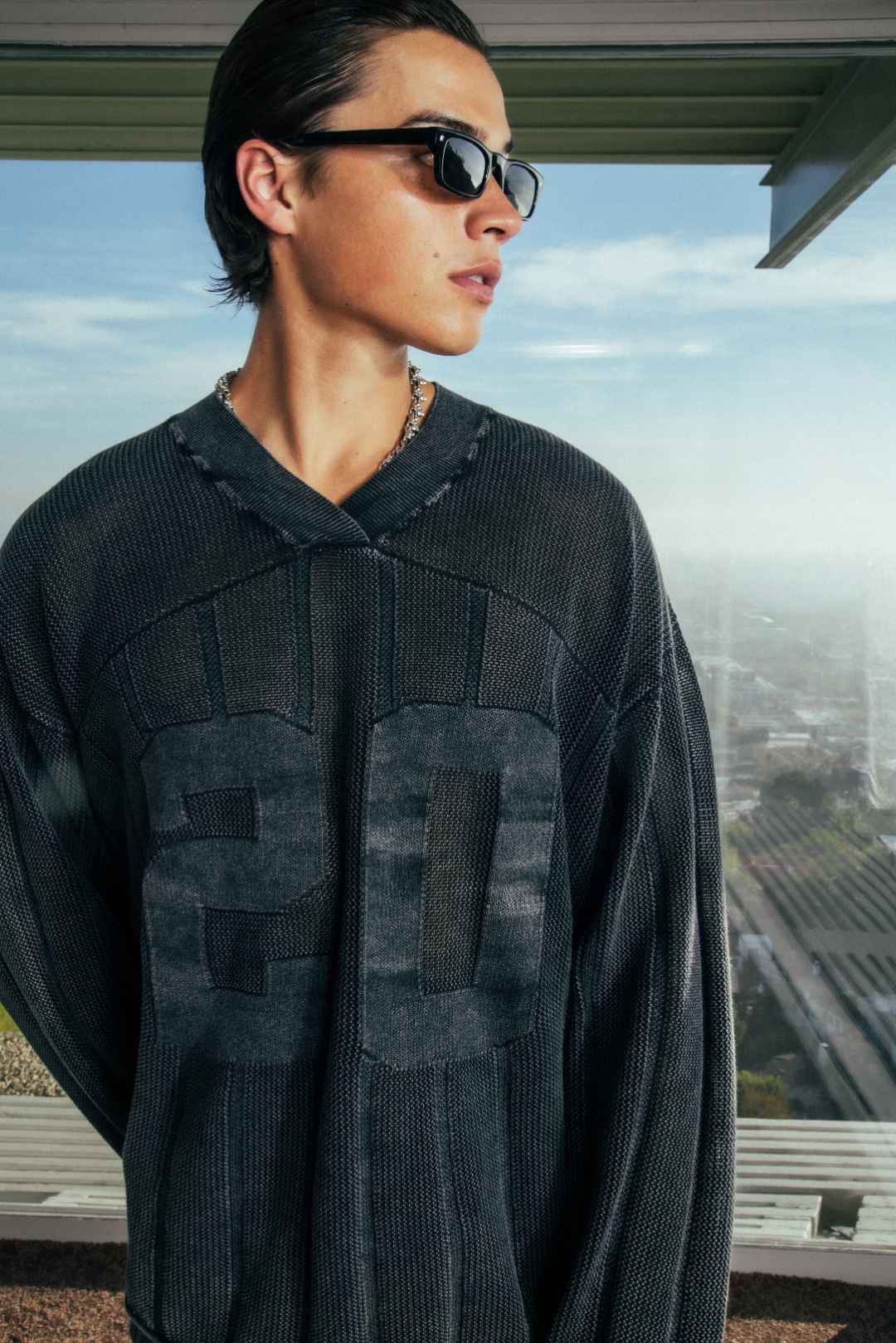 Model wearing the Knitted Varsity Long Sleeve Jersey in Vintage Grey